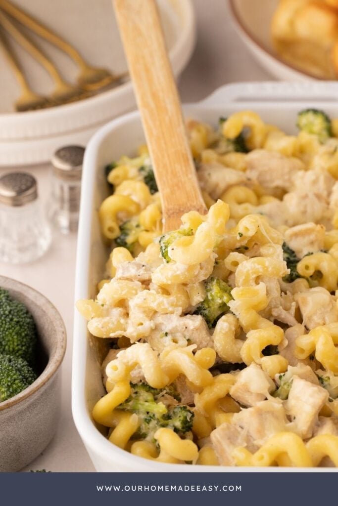 wooden spoon in chicken pasta dinner