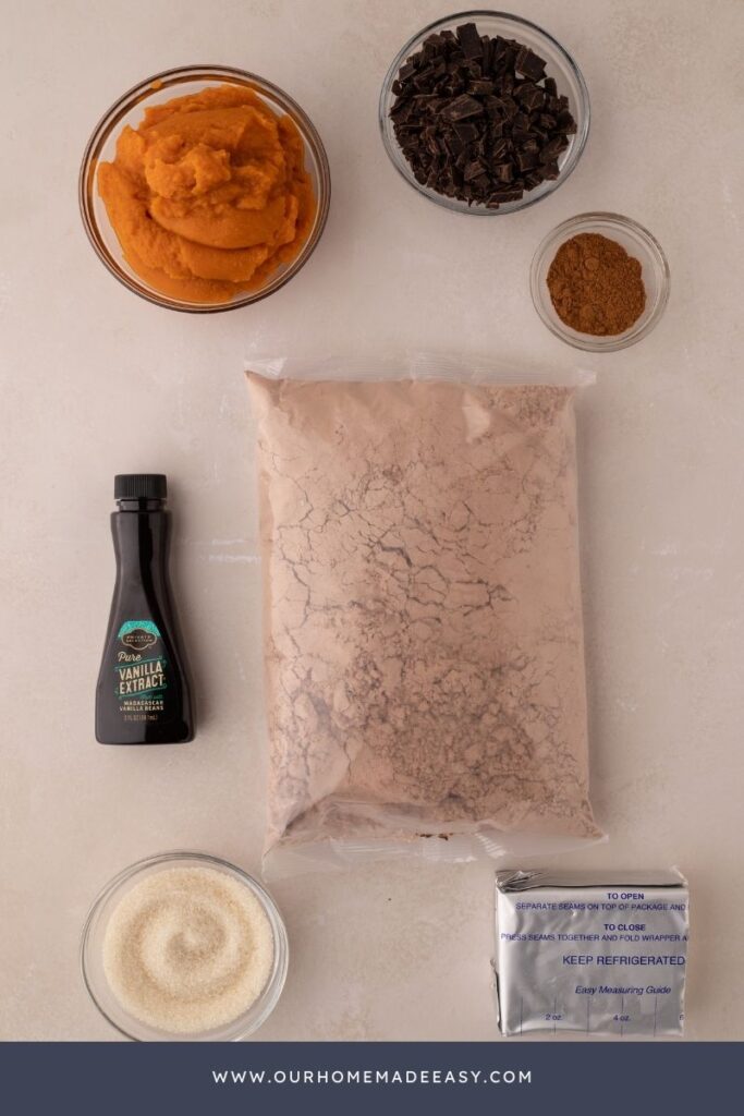 pumpkin brownie ingredients on countertop, including brownie box mix