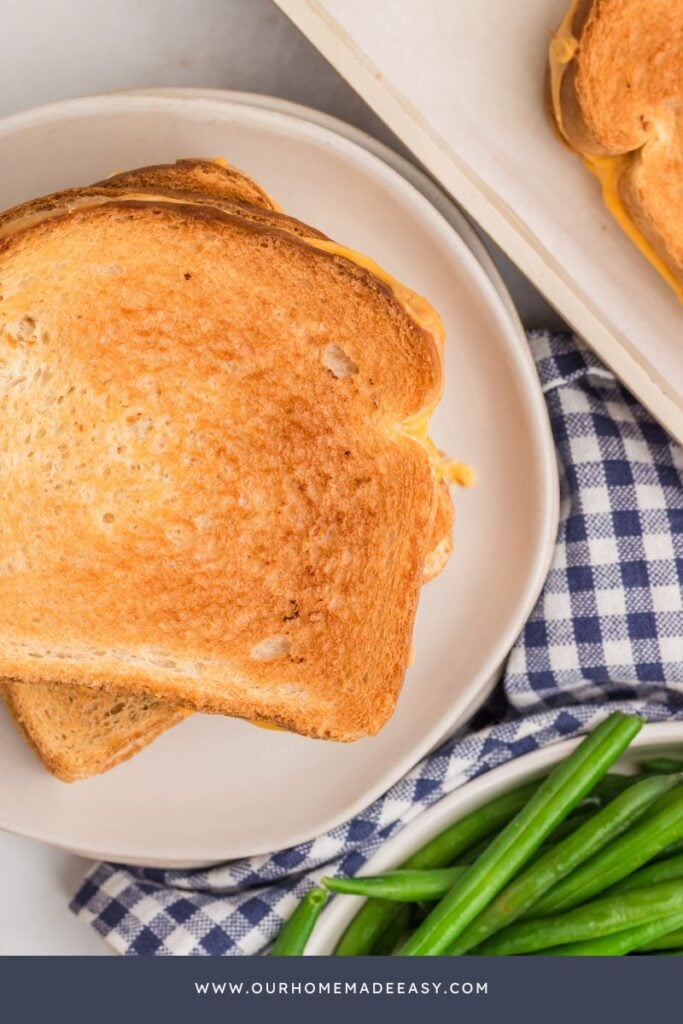 plated grilled cheese with cheddar and american cheese