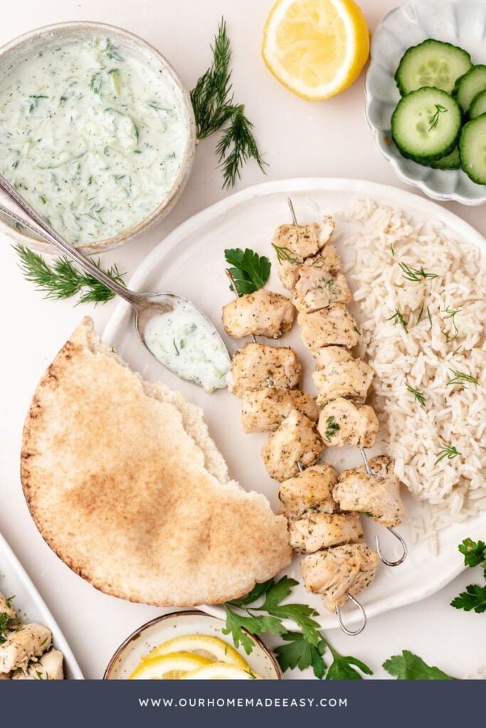 tzatziki ranch dip on plate with grilled chicken and pita bread