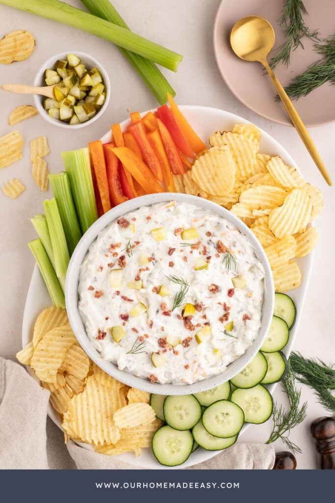 pickle dip snack board with fresh veggies and chips