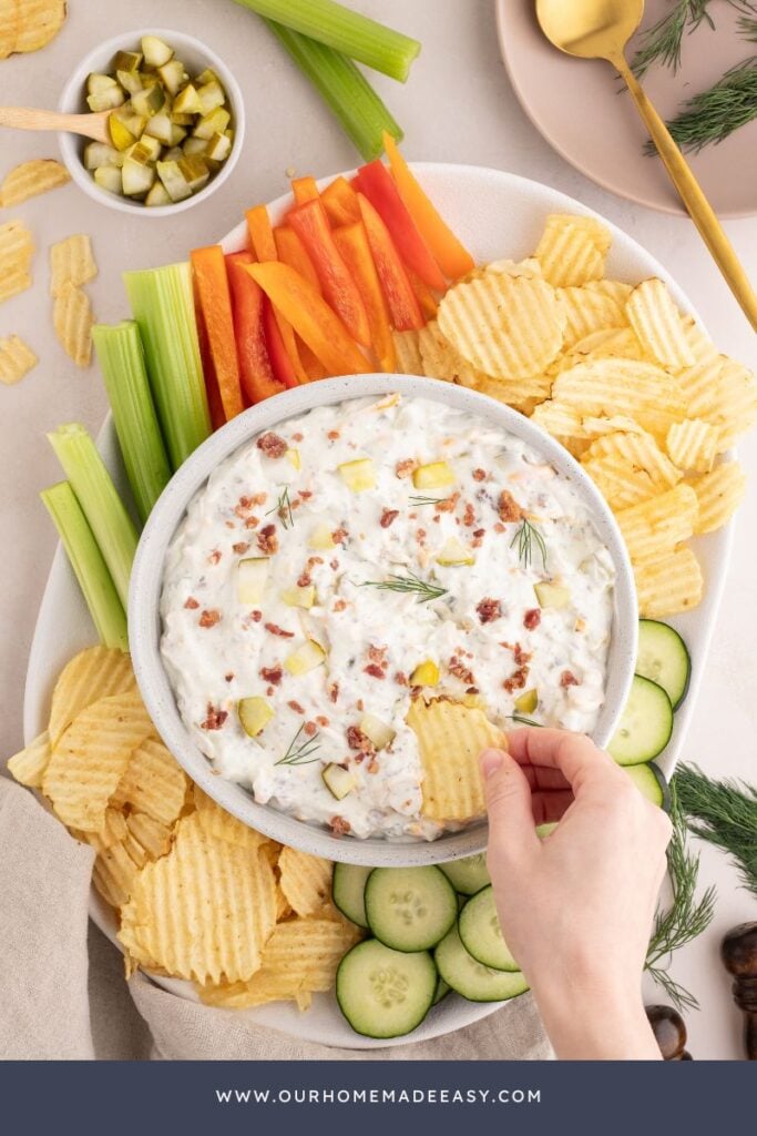 creamy dill pickle dip on snack board