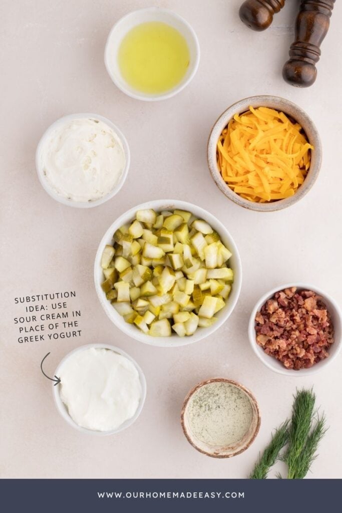 ingredients for creamy dill pickle dip with bacon ranch and greek yogurt on countertop