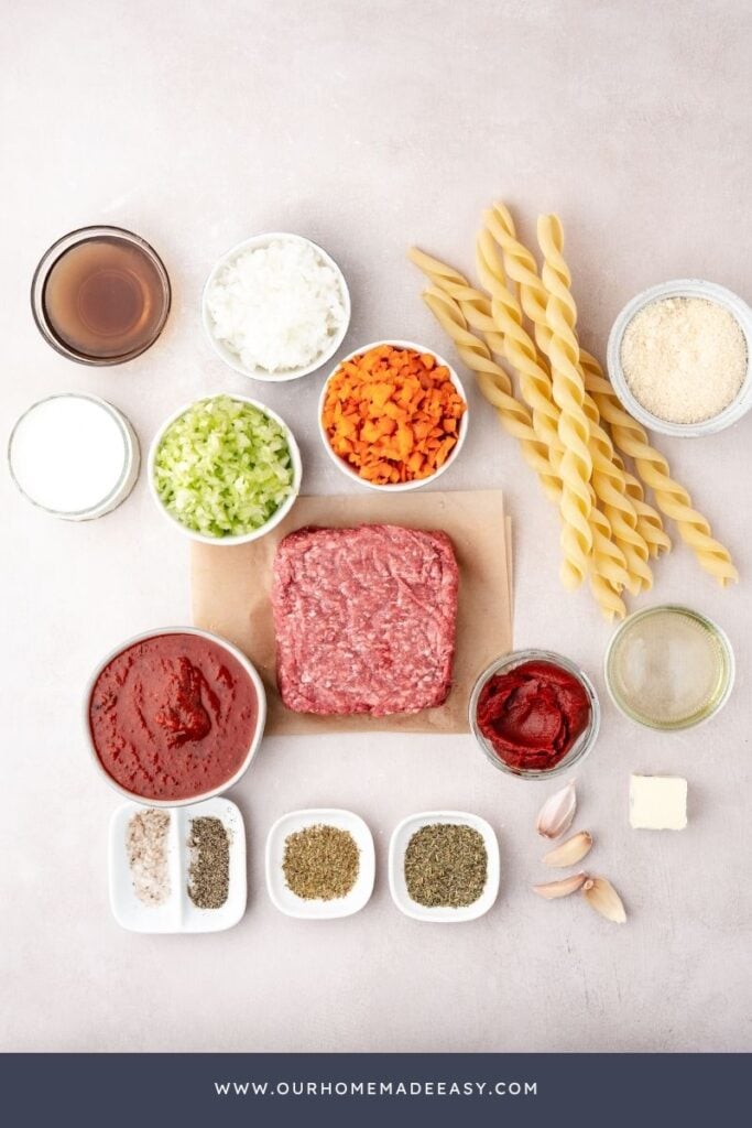 easy bolognese recipe ingredients on counter top with celery and carrots