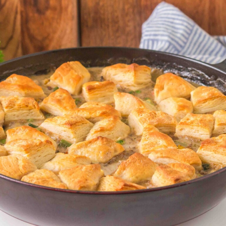 This ground beef pot pie is made with a creamy beef and vegetable filling and golden refrigerated biscuits baked right on top.